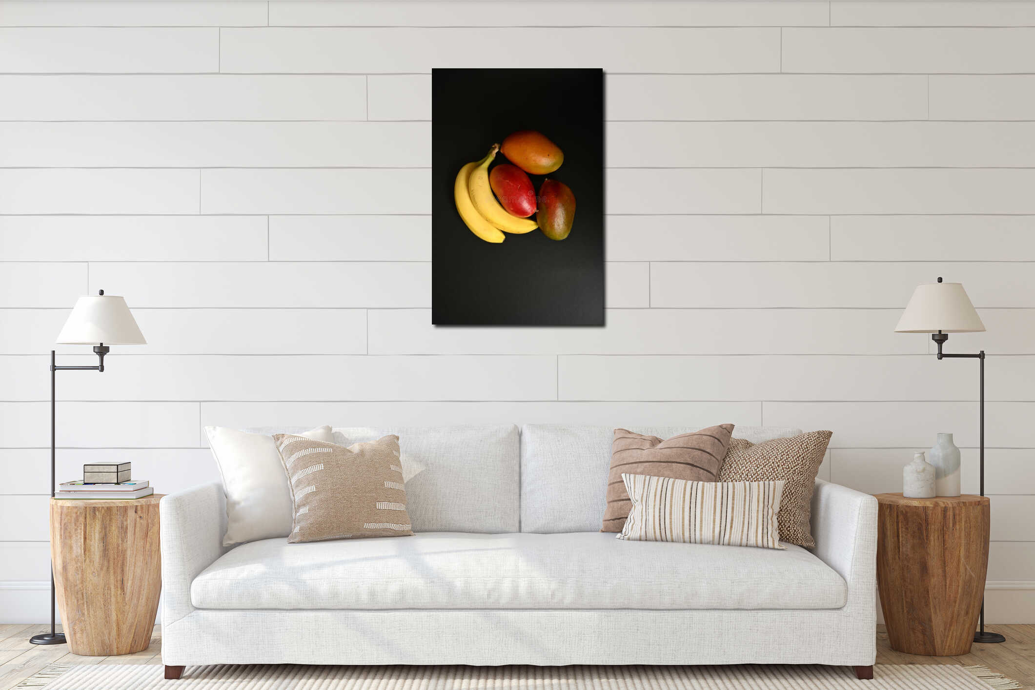 Bright ripe mango lying on bananas on black background forming colorful tropical fruit composition interior mockup