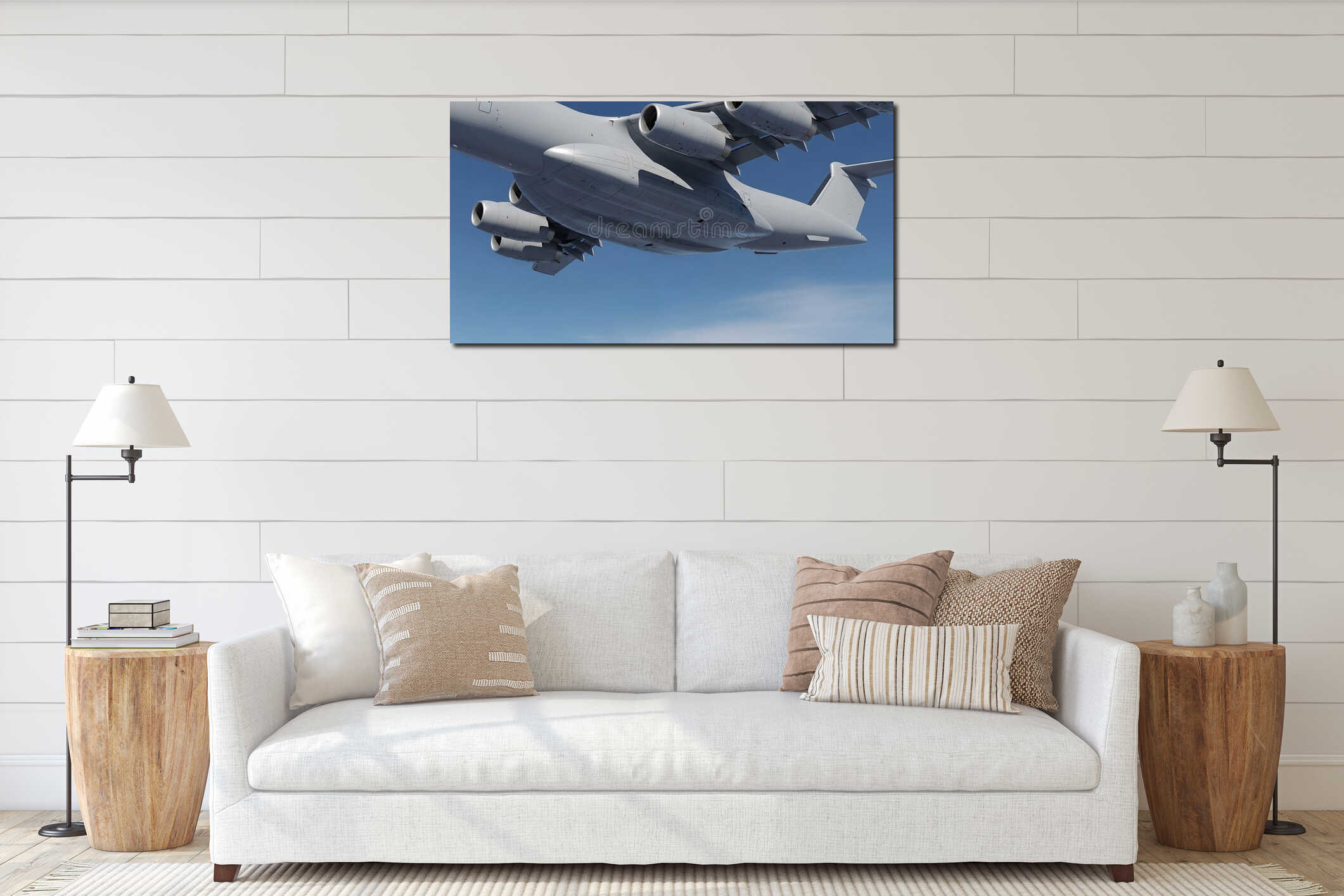 Massive military transport aircraft with four engines flies high above the bright blue sky interior mockup