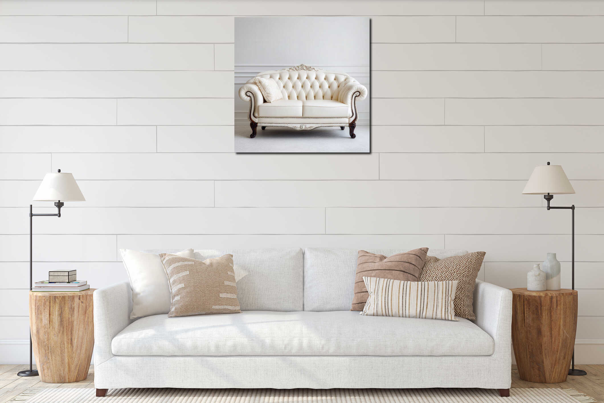 Elegant cream leather tufted sofa with ornate wooden legs and trim against a white classic wall in a bright living room, interior mockup