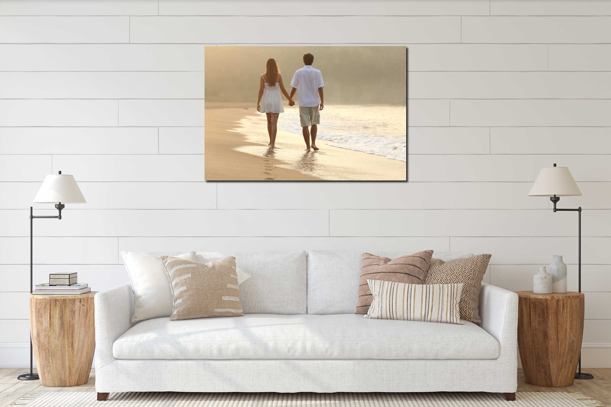 Couple walking and holding hands on the sand of a beach interior mockup