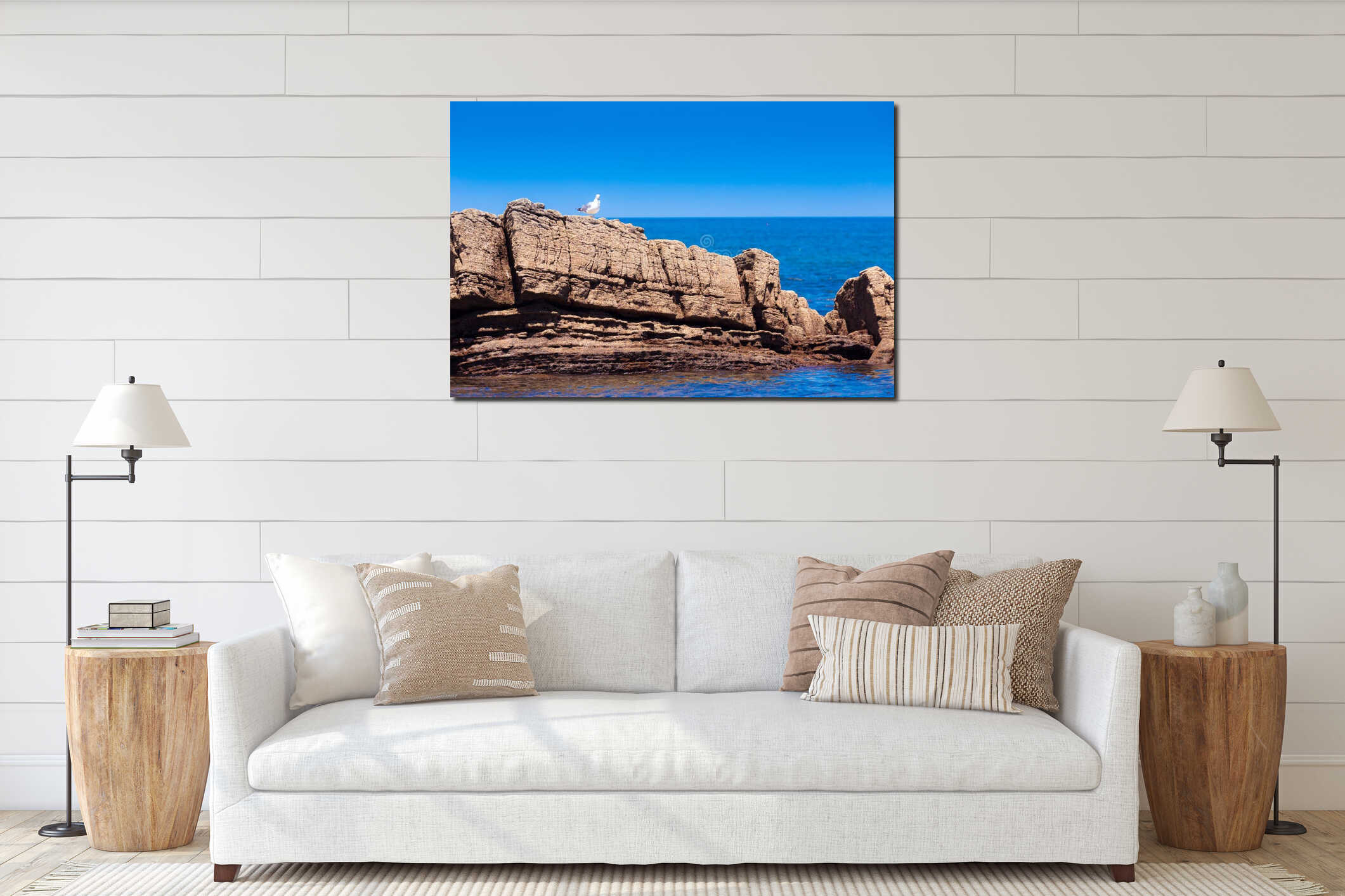 White seagull on rocky beach interior mockup