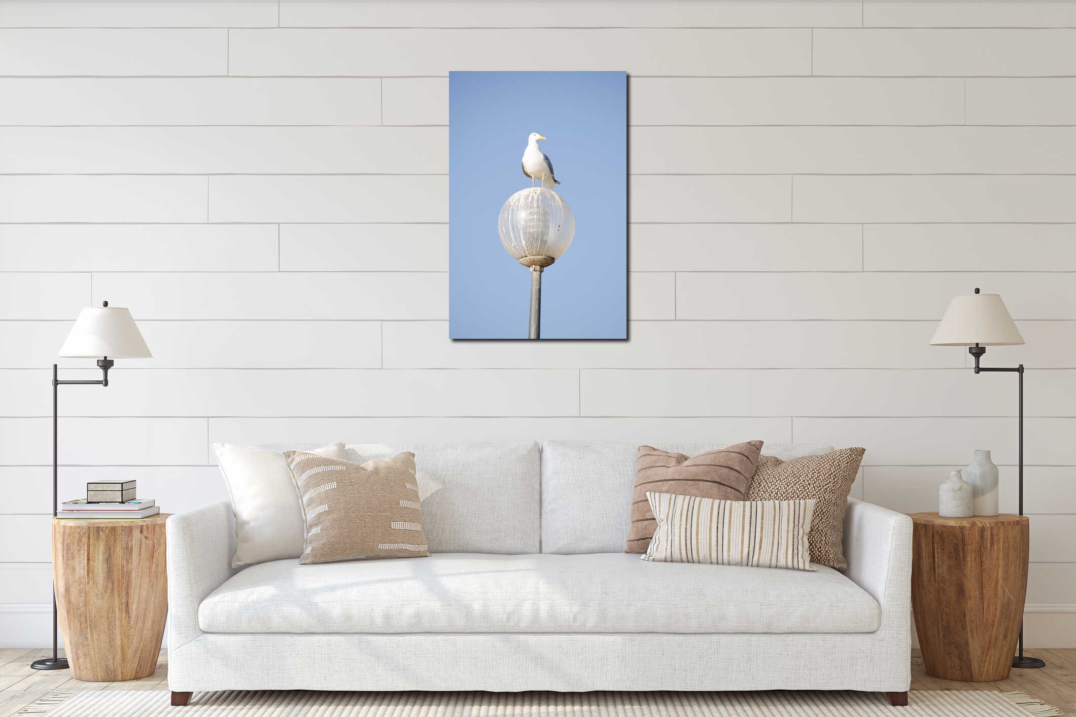 A seagull perched a lamp set against a bright blue sky interior mockup
