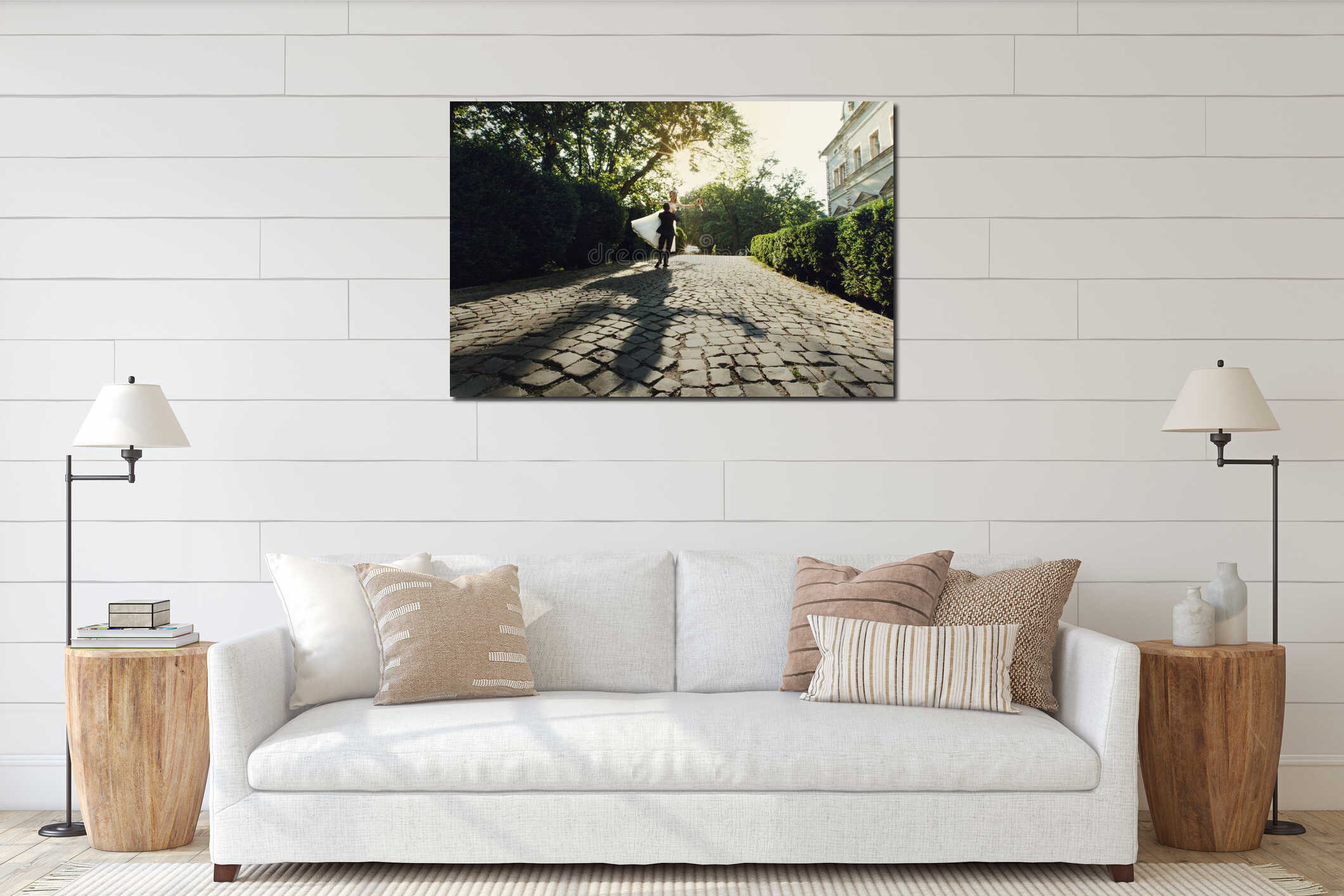 Beautiful young bride and handsome groom holding in the air outdoors near old mansion at sunset shadow interior mockup
