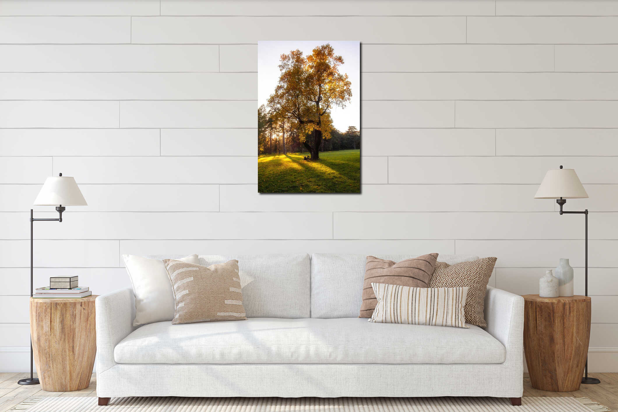 two people sitting on the lawn under a lonely high tree with yellow foliage in autumn. interior mockup