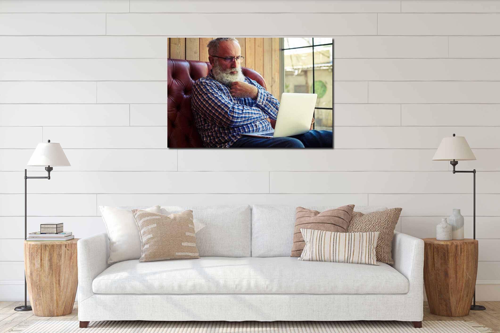 Pensive old man sitting on couch interior mockup