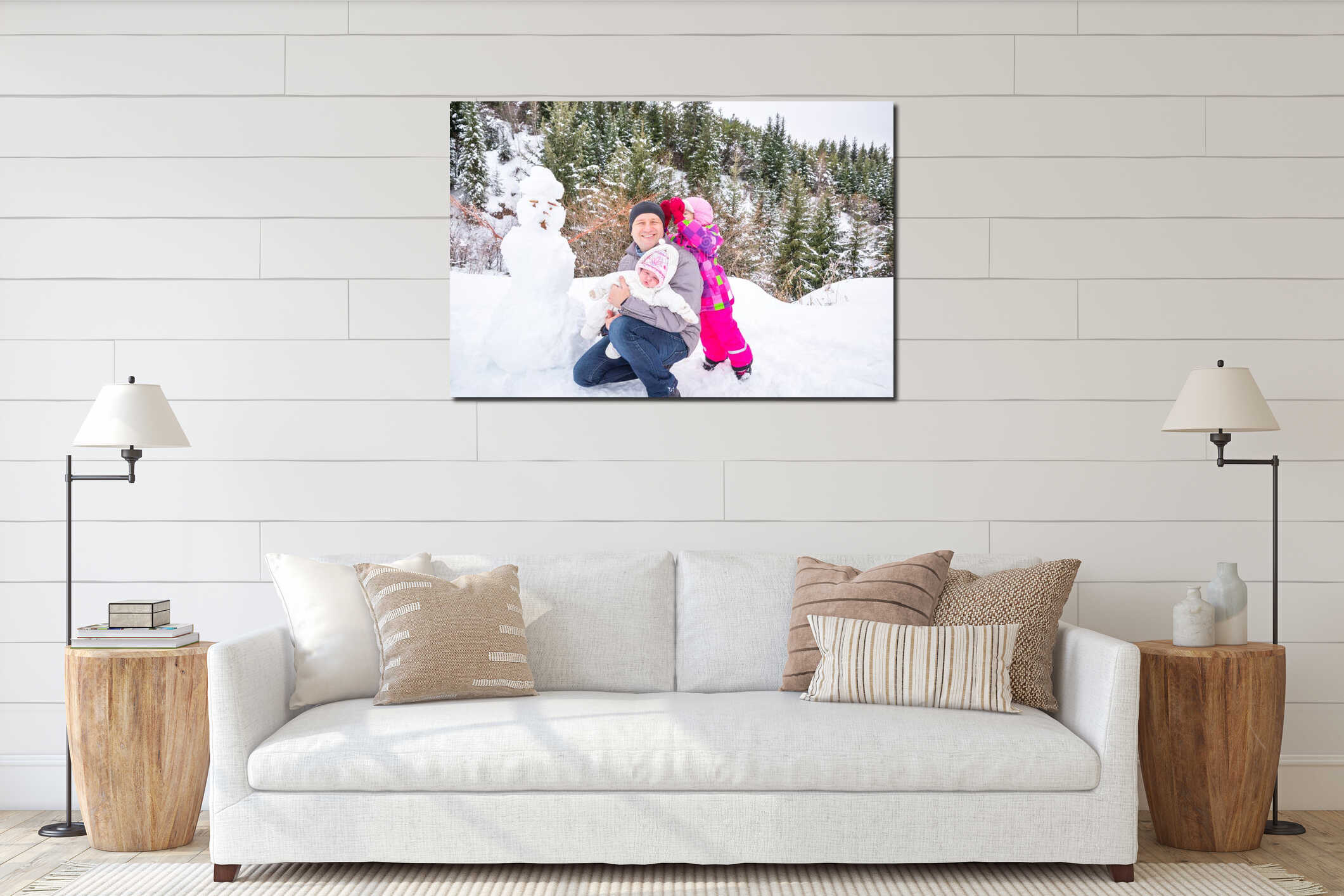 Happy father and his two daughters building a snowman on winter day. Family playing on nature with forest in background. interior mockup