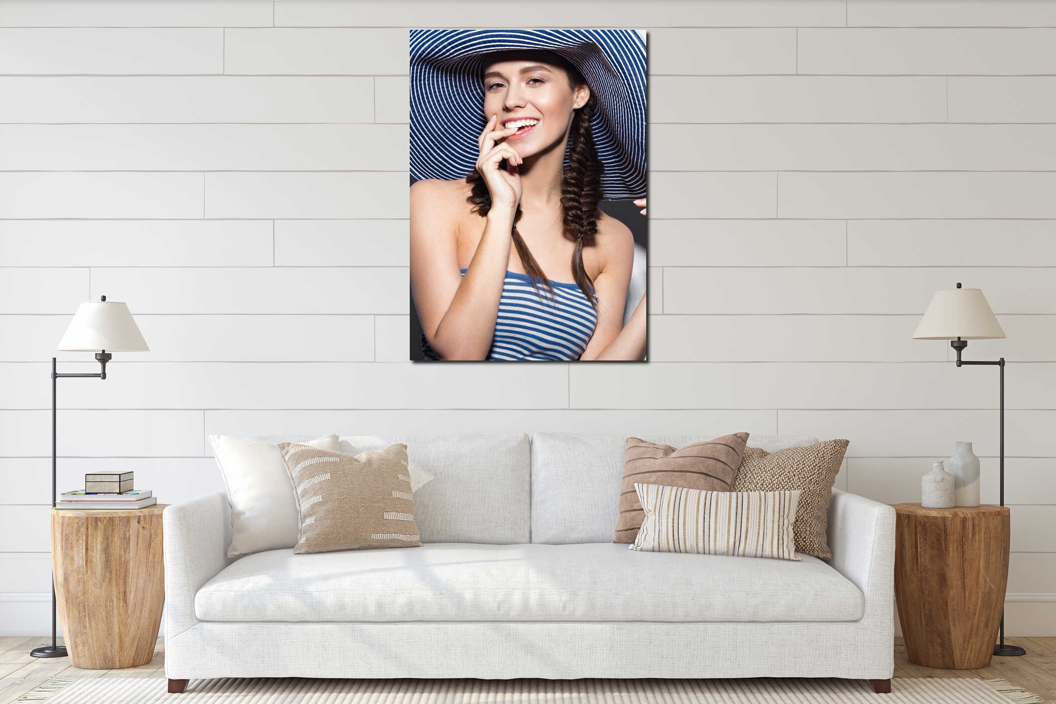 Beautiful cheerful girl in a summer beach striped hat. The beauty of the face. interior mockup