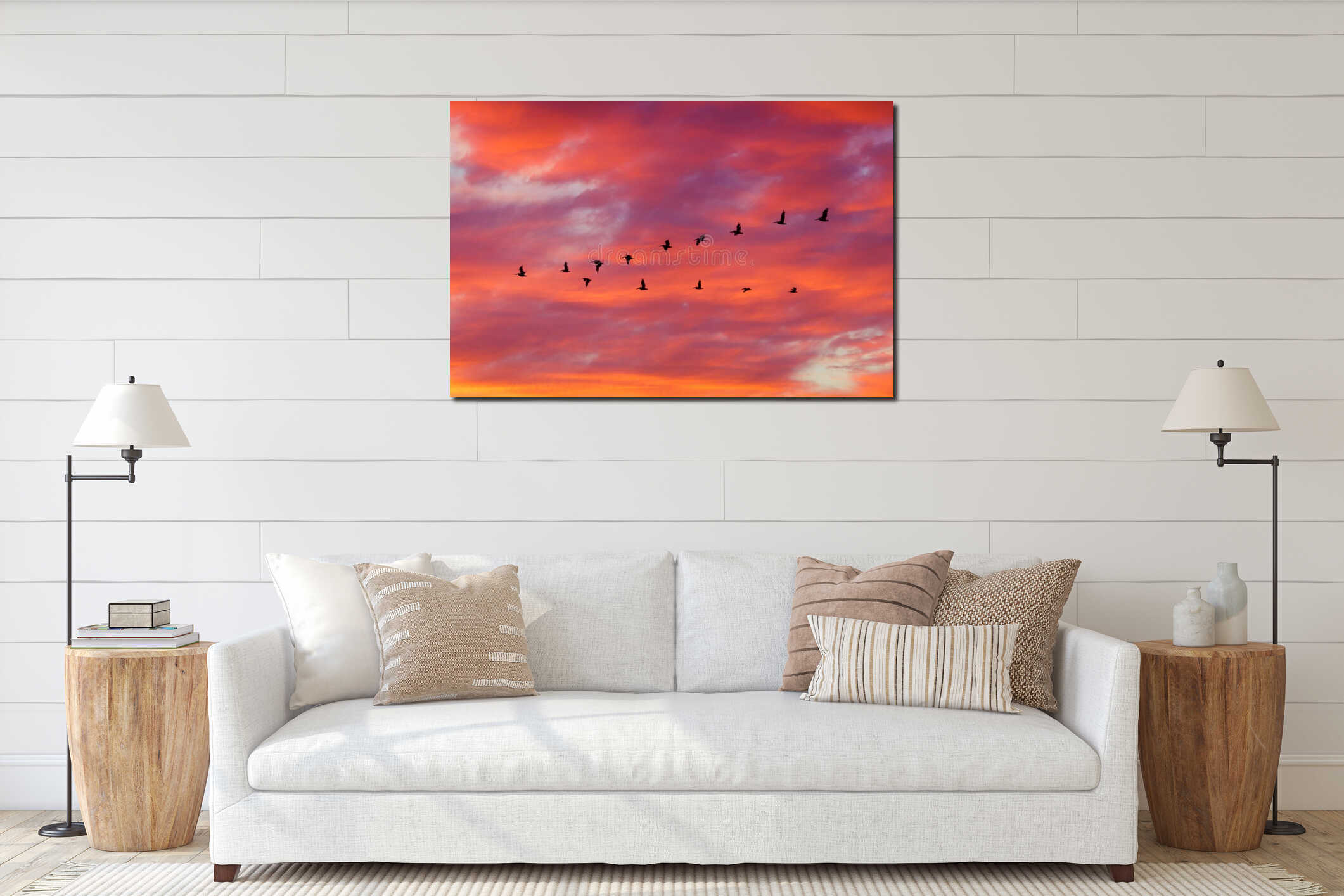 Birds flying in formation at Sunset interior mockup