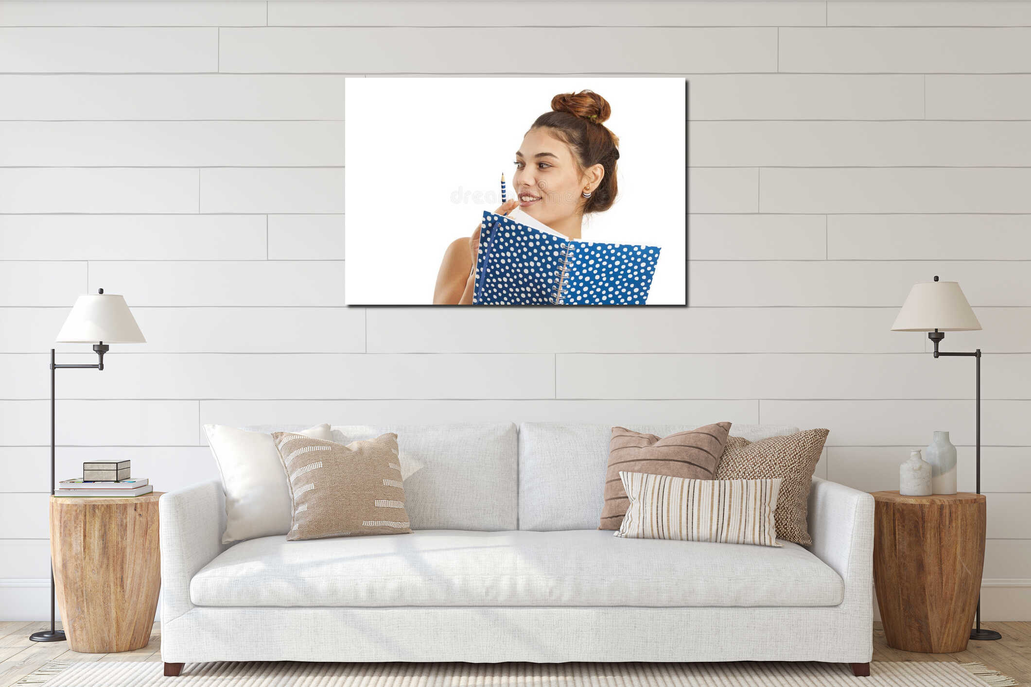 Young woman holding notebook and looking away interior mockup
