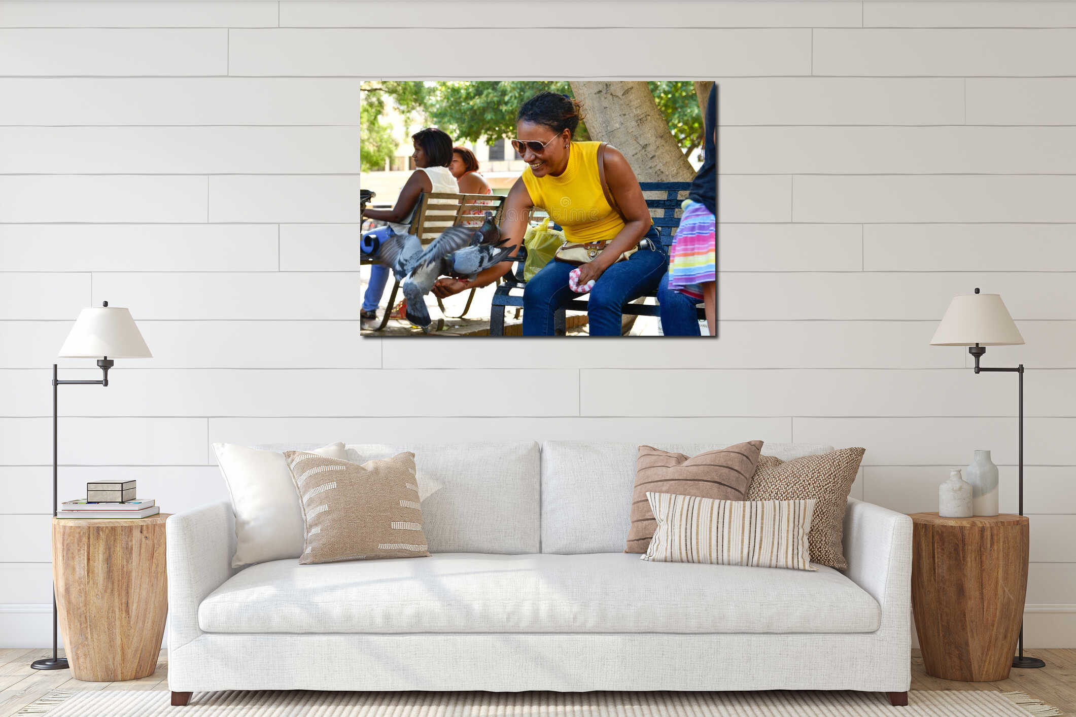Santo Domingo, Dominican Republic. Woman feeds pigeons on Columbus Park, Colonial Zone of Santo Domingo. interior mockup