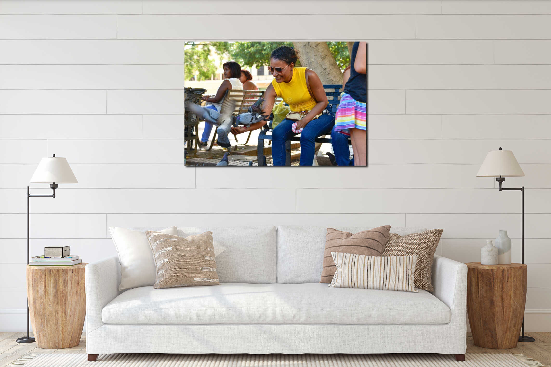 Santo Domingo, Dominican Republic. Woman feeds pigeons on Columbus Park, Colonial Zone of Santo Domingo. interior mockup