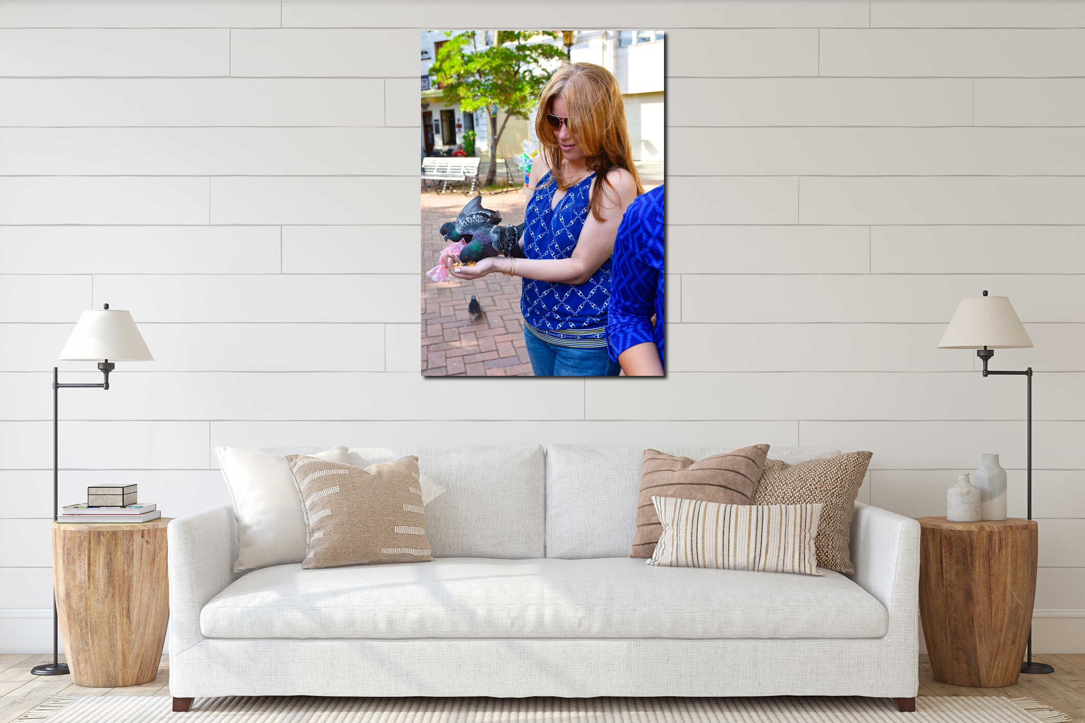 Santo Domingo, Dominican Republic. Woman feeds pigeons on Columbus Park, Colonial Zone of Santo Domingo. interior mockup