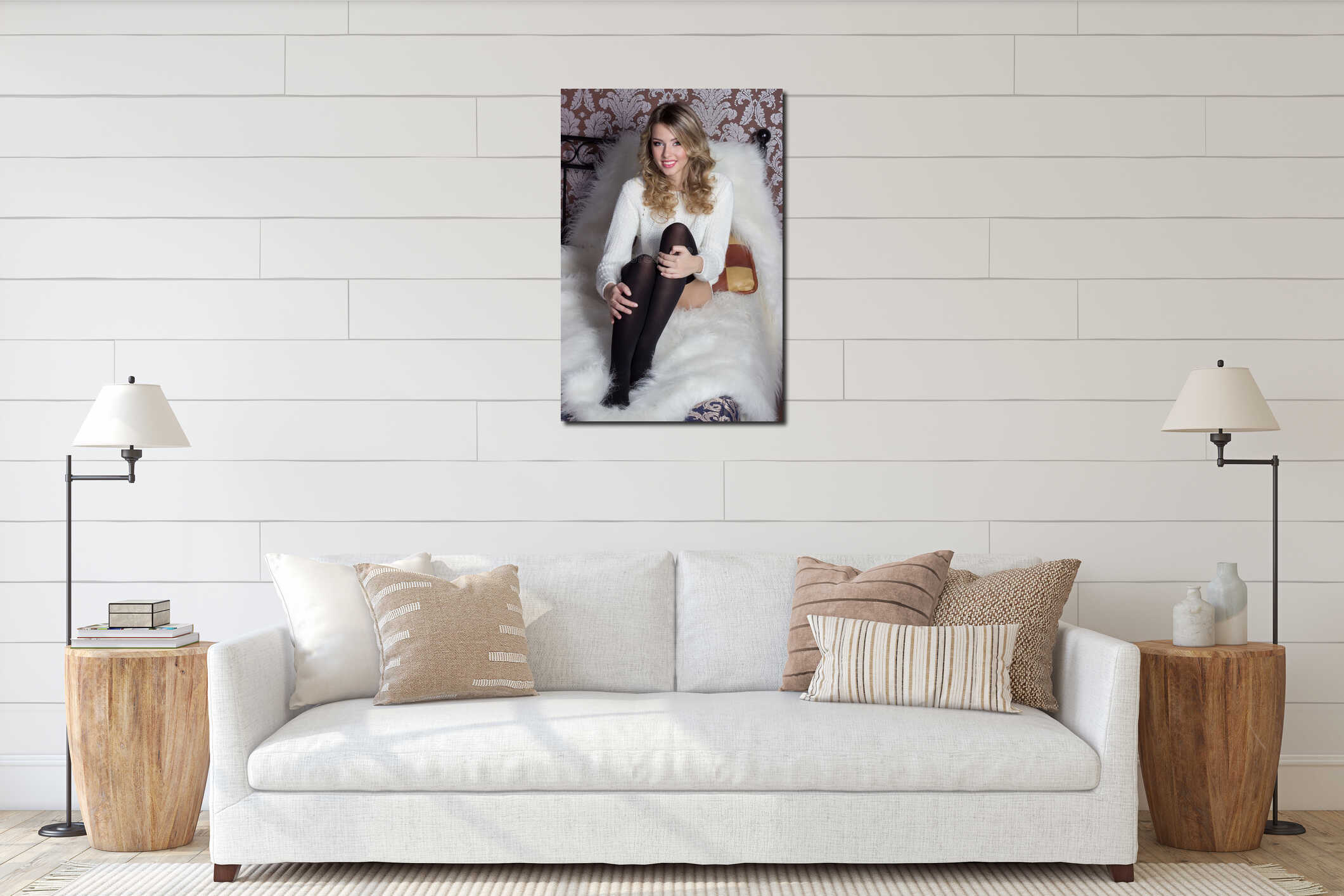 Beautiful cheerful cute girl with a bright smile snow-white sitting in a warm sweater and socks in bed interior mockup