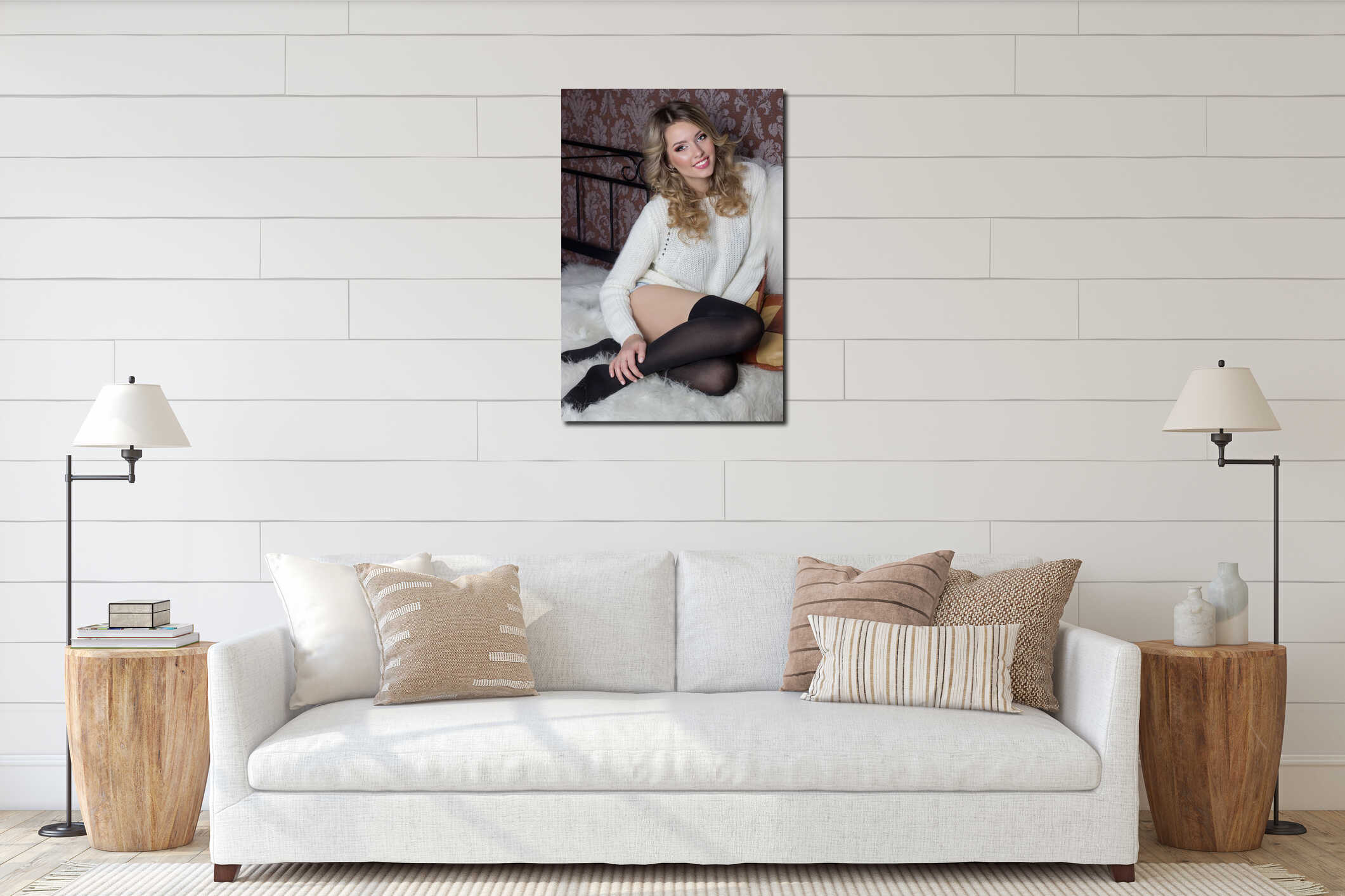 Beautiful cheerful cute girl with a bright smile snow-white sitting in a warm sweater and socks in bed interior mockup