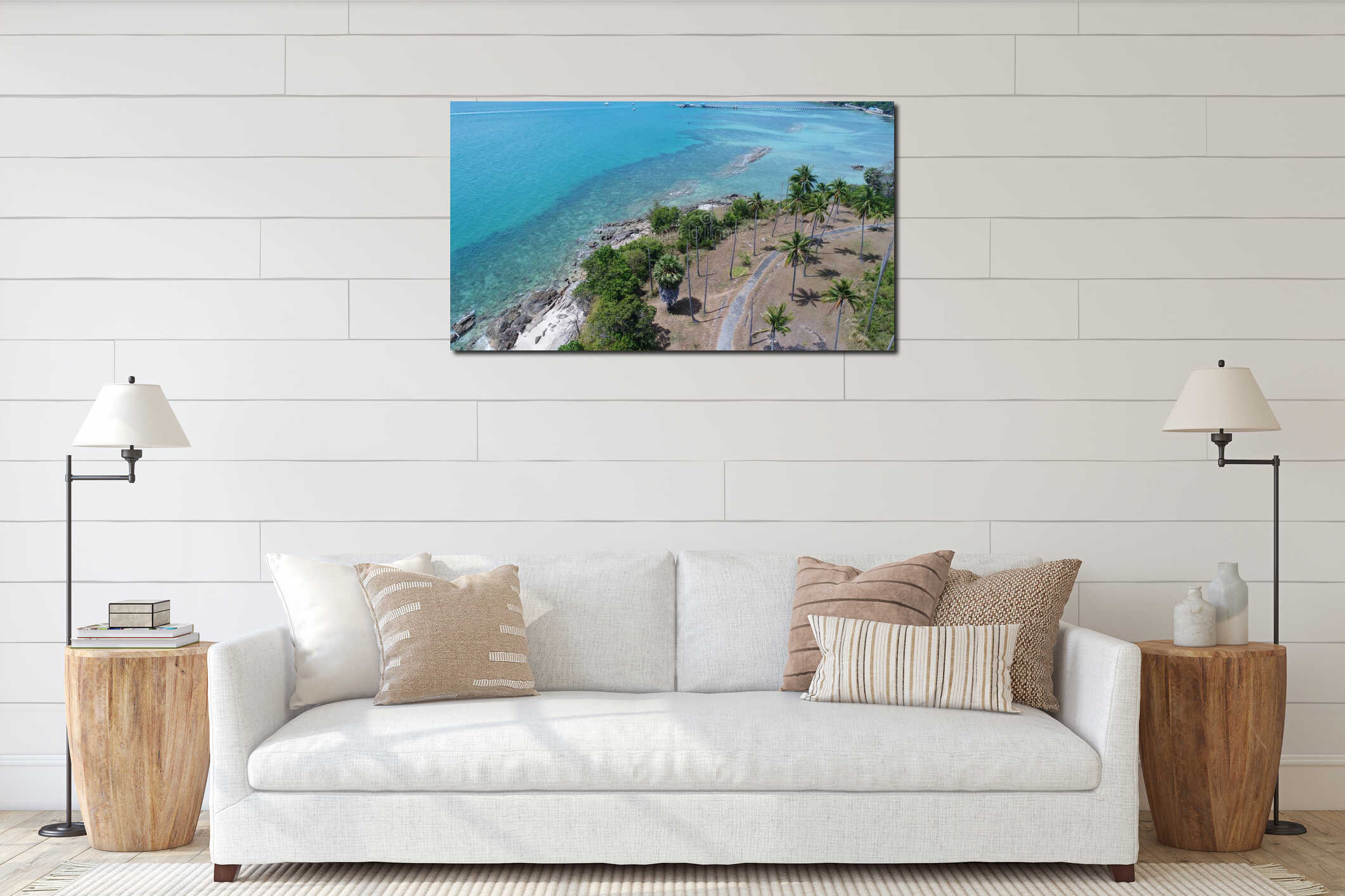 Aerial view of sea coastline and island with palm trees with pier in the background interior mockup