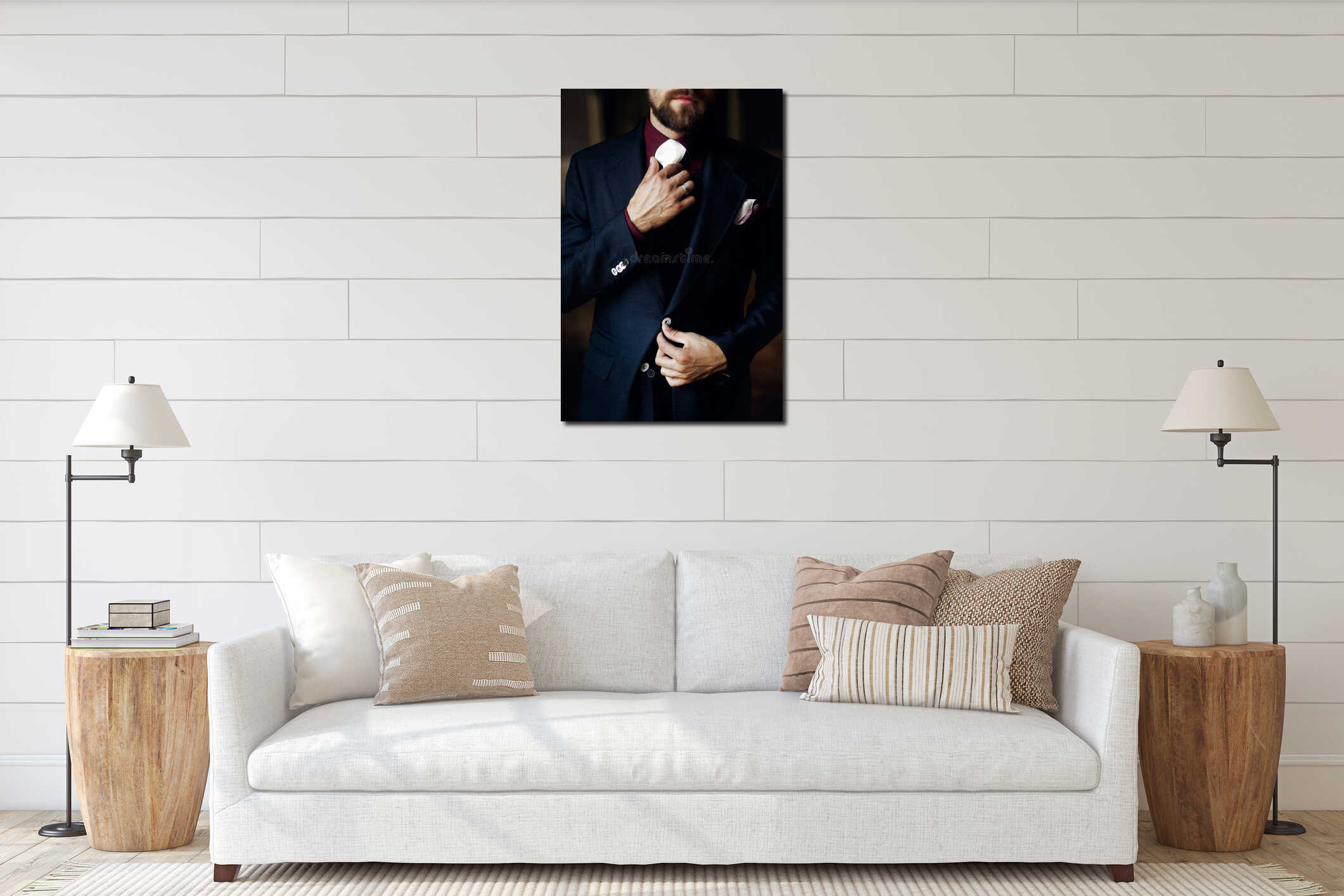 Elegant stylish handsome groom getting ready in morning. holding interior mockup