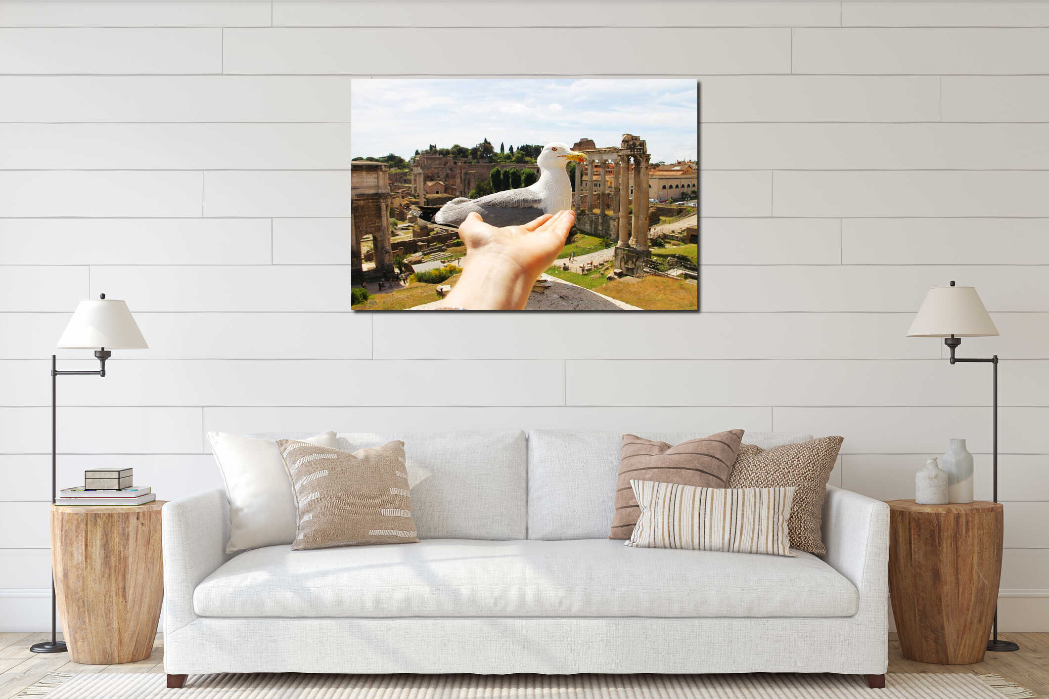 A large white seagull with a red stroke around the eye and a beak, on which the down and a palm stretched to the bird. interior mockup