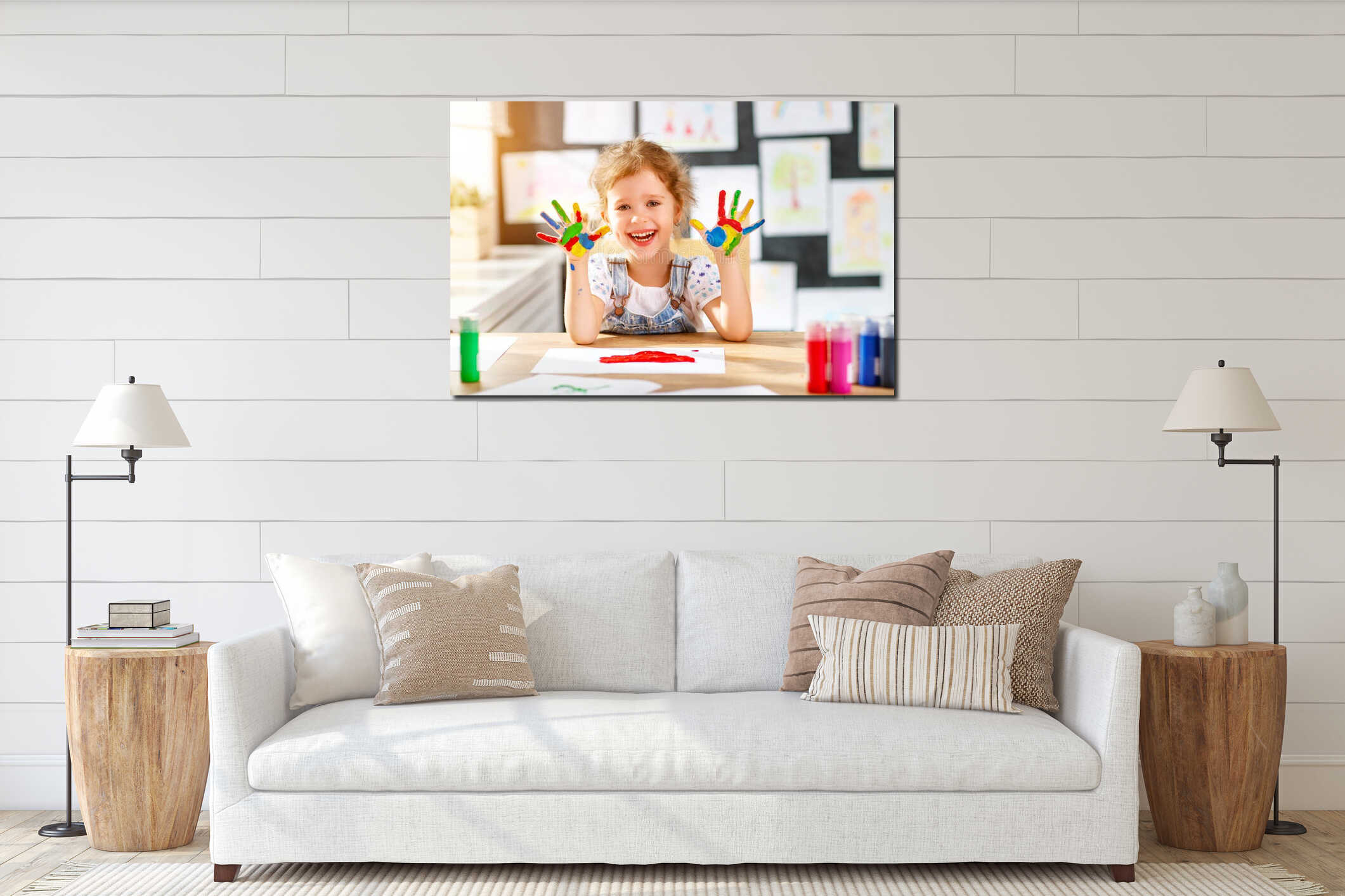 Funny child girl draws laughing shows hands dirty with paint interior mockup