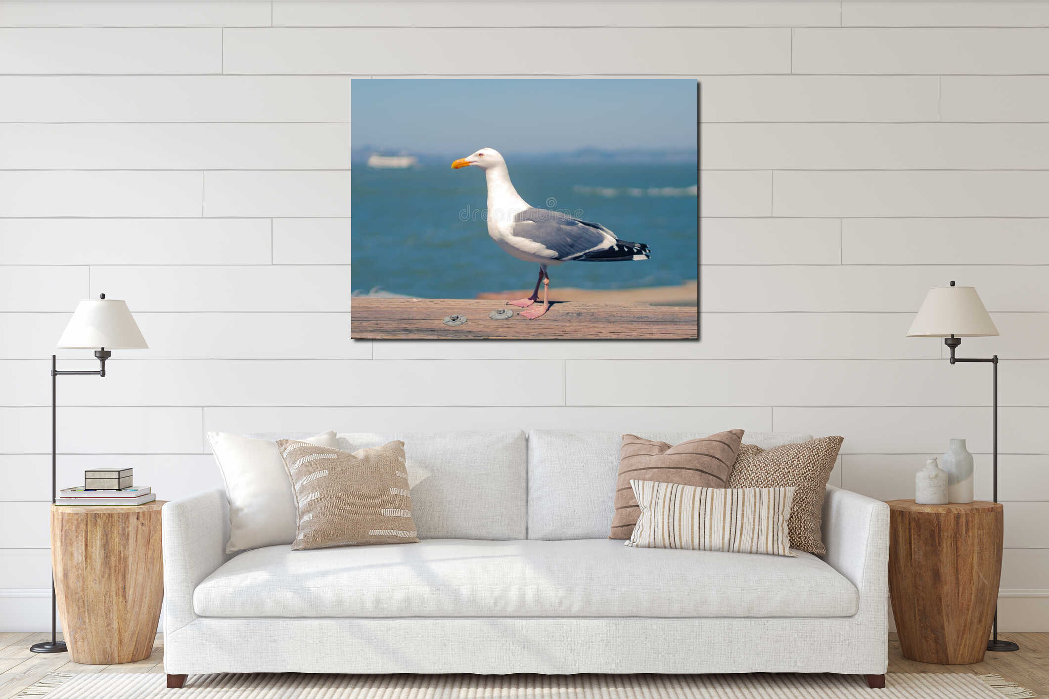Seagull resting in warm tones on wooden rail near sea interior mockup