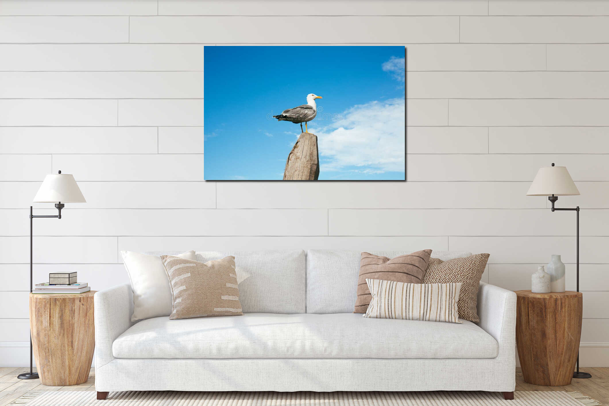 Seagull standing on a wooden fence against blue sky interior mockup