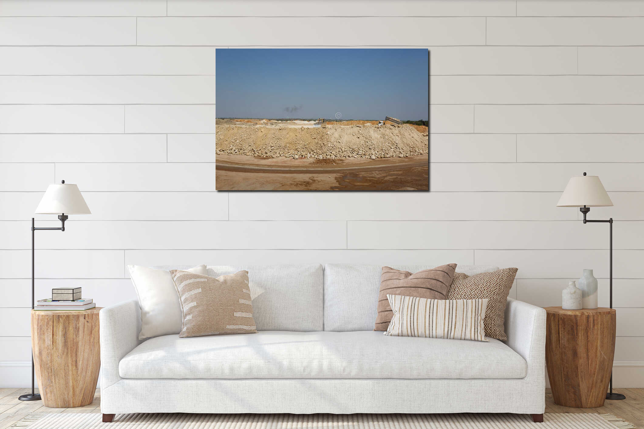 A backhoe loader, a loader backhoe, digger on a heap of sand and stones on a natural background. interior mockup