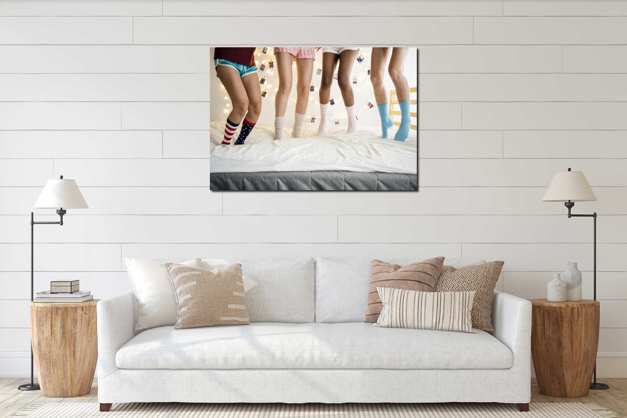 Closeup of two pairs of legs with socks jumping on the bed interior mockup